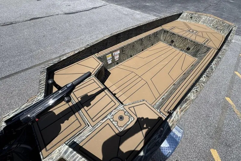 Slide: The Image of 2026 Tracker Grizzly 1650 T Prairie Wings Edition boat with camouflage interior design. - 10