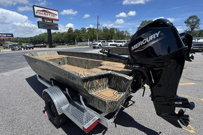 Slide: The Image of 2026 Tracker Grizzly 1650 T Prairie Wings Edition boat with Mercury engine on trailer. - 5