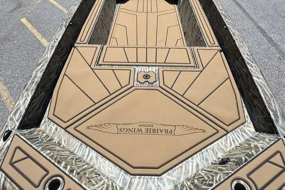 Slide: The Image of 2026 Tracker Grizzly 1650 T Prairie Wings Edition boat interior, featuring custom design. - 7