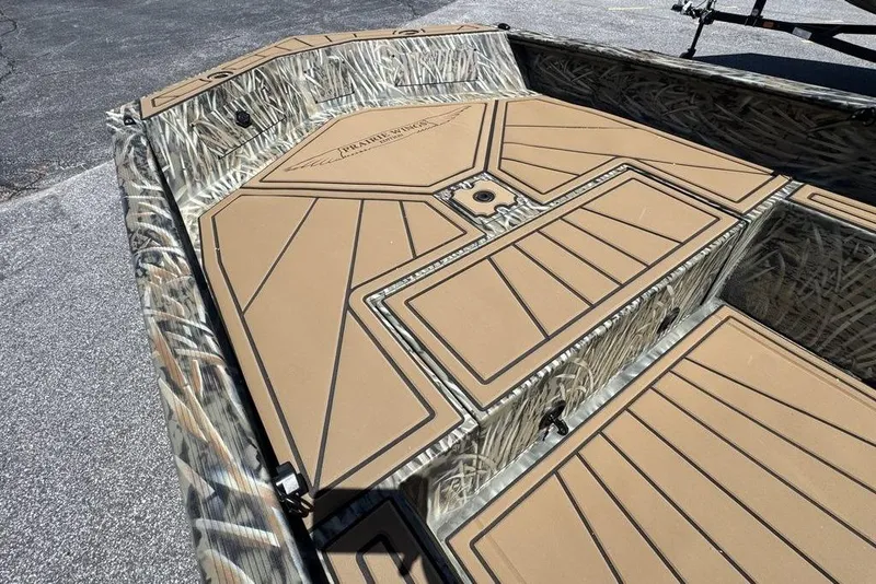 Slide: The Image of 2026 Tracker Grizzly 1650 T Prairie Wings Edition boat interior with camo design. - 9