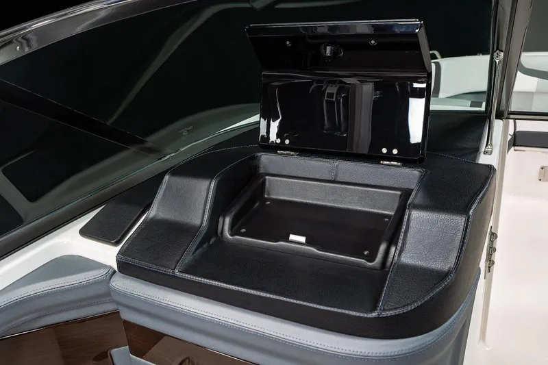 Slide: The Image of Manufacturer Provided Image: 2023 Chaparral 307 SSX boat dashboard with open storage compartment. - 11