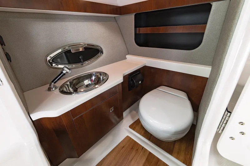 Slide: The Image of Manufacturer Provided Image: 2023 Chaparral 307 SSX boat bathroom with sink and toilet - 20