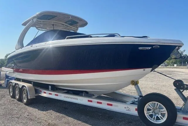 Slide: The Image of 2023 Chaparral 307 SSX boat on a trailer, featuring sleek design and modern features. - 23