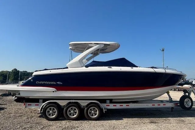 Slide: The Image of 2023 Chaparral 307 SSX boat on a trailer, featuring sleek design and modern features. - 25