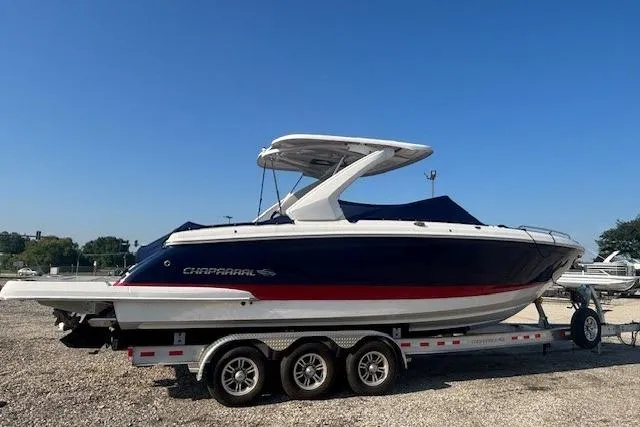 Slide: The Image of 2023 Chaparral 307 SSX boat on a trailer, featuring sleek design and modern features. - 26