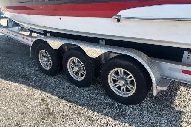 Slide: The Image of 2023 Chaparral 307 SSX boat on a triple-axle trailer, side view. - 29