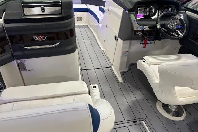 Slide: The Image of 2023 Chaparral 307 SSX boat interior with modern dashboard and luxurious seating. - 42