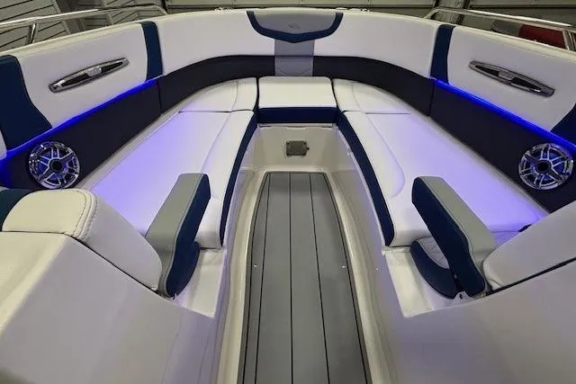 Slide: The Image of Luxurious interior of 2023 Chaparral 307 SSX boat with blue LED lighting and plush seating. - 46