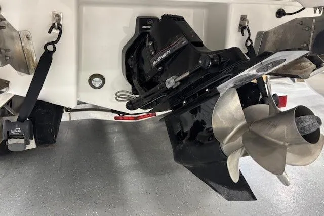 Slide: The Image of 2023 Chaparral 307 SSX boat stern with Mercury outdrive and propeller. - 54