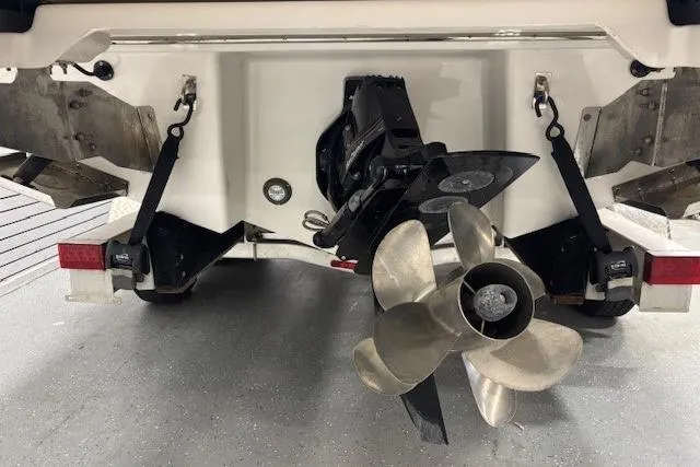 Slide: The Image of Rear view of 2023 Chaparral 307 SSX boat showing propeller and stern details. - 55