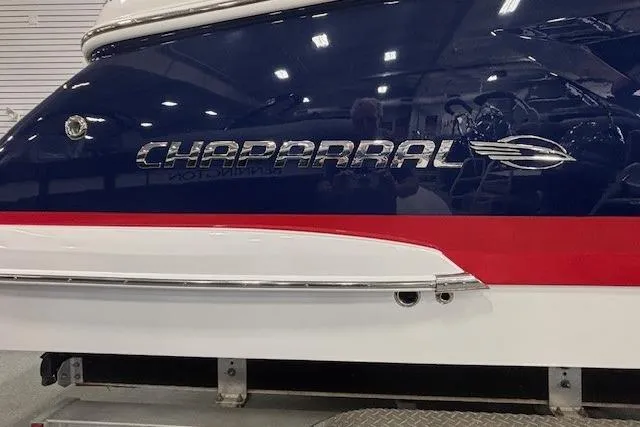 Slide: The Image of 2023 Chaparral 307 SSX boat with sleek design and bold logo. - 63