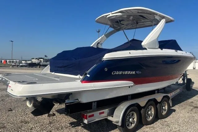 Slide: The Image of 2023 Chaparral 307 SSX boat on a trailer, covered and ready for transport. - 7