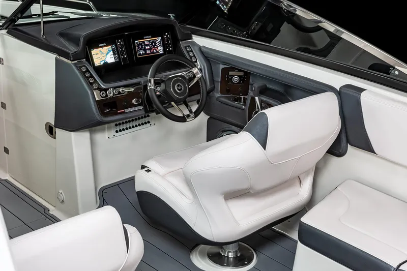 Slide: The Image of Manufacturer Provided Image: 2023 Chaparral 307 SSX boat interior with modern dashboard and white seating. - 9