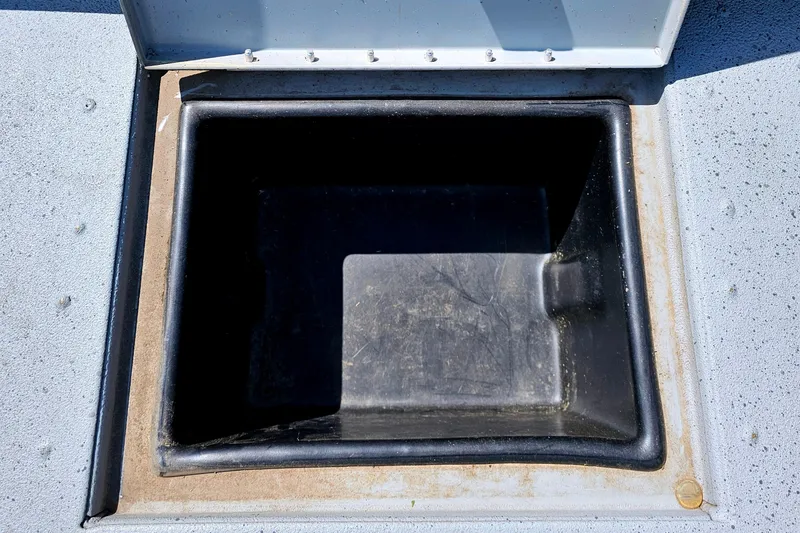 Slide: The Image of Open storage compartment on a 2017 Ranger RT188 boat. - 12