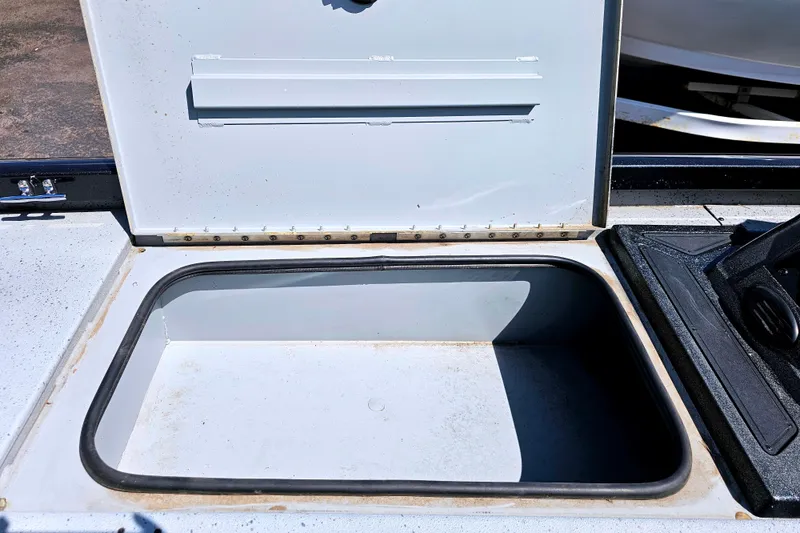Slide: The Image of Open storage compartment on a 2017 Ranger RT188 boat. - 15