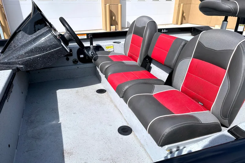 Slide: The Image of 2017 Ranger RT188 boat interior with red and black seating, steering console visible. - 7