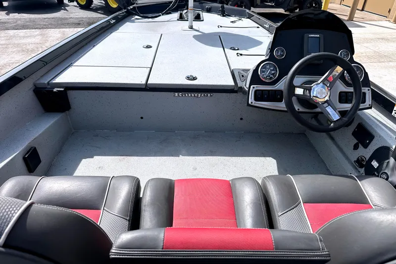 Slide: The Image of 2017 Ranger RT188 boat interior with steering wheel and red-black seating. - 8