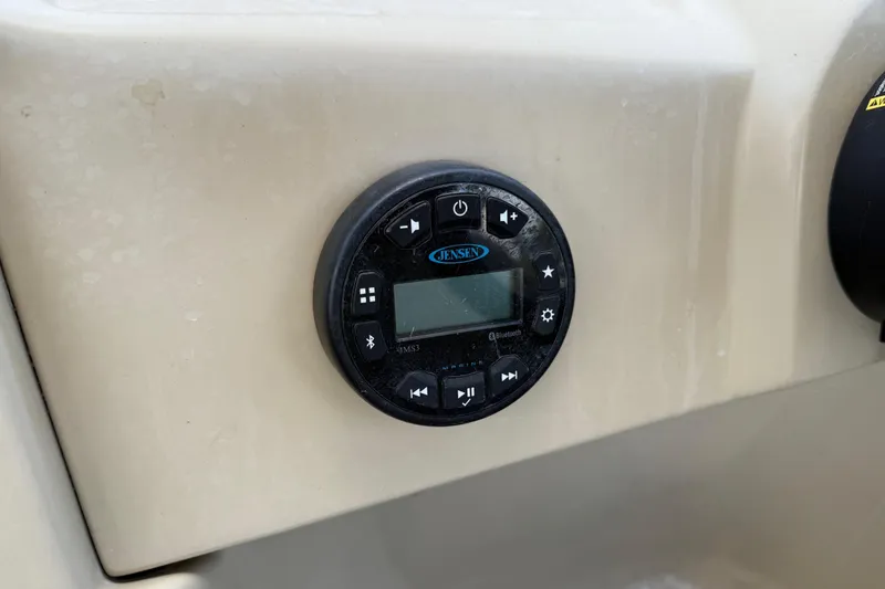 Slide: The Image of Control panel of 2019 SunChaser Geneva Cruise 22 LR PSB boat with Jensen audio system. - 14