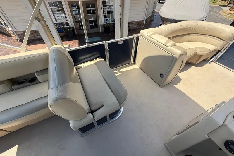 Slide: The Image of 2019 SunChaser Geneva Cruise 22 LR PSB interior with beige seating and open deck. - 18