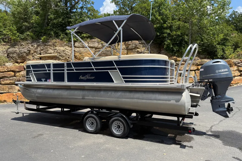 Slide: The Image of 2019 SunChaser Geneva Cruise 22 LR PSB pontoon boat on trailer, with Yamaha outboard motor. - 2