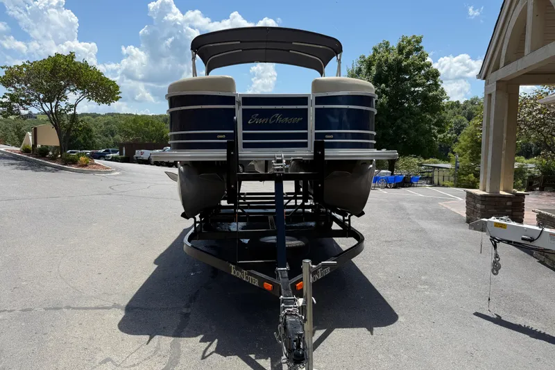 Slide: The Image of 2019 SunChaser Geneva Cruise 22 LR PSB pontoon boat on trailer, parked outdoors. - 3