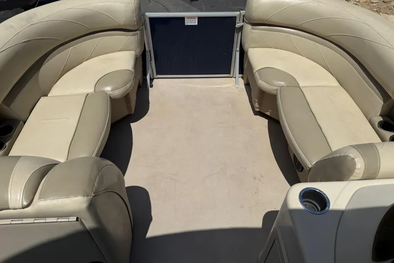 Slide: The Image of 2019 SunChaser Geneva Cruise 22 LR PSB pontoon boat interior with beige seating. - 8