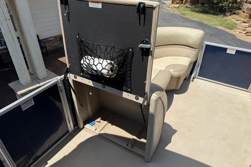 Slide: The Image of 2019 SunChaser Geneva Cruise 22 LR PSB interior with storage compartment and seating. - 9