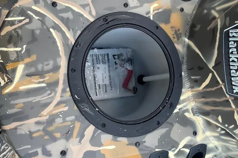 Slide: The Image of War Eagle 2170 Blackhawk 2026 boat storage compartment with camouflage design. - 15