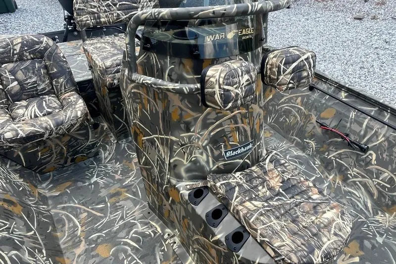 Slide: The Image of Camouflage interior of 2026 War Eagle 2170 Blackhawk boat with seating and console. - 16