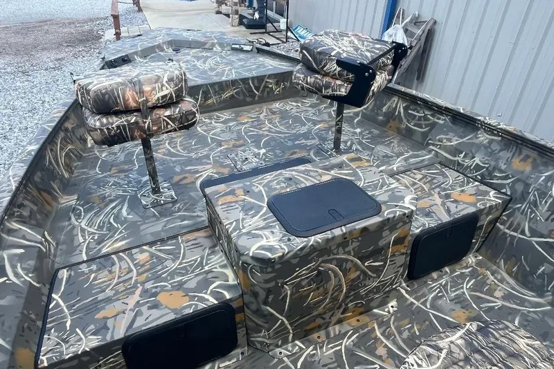 Slide: The Image of 2026 War Eagle 2170 Blackhawk boat with camouflage seating and deck design. - 19