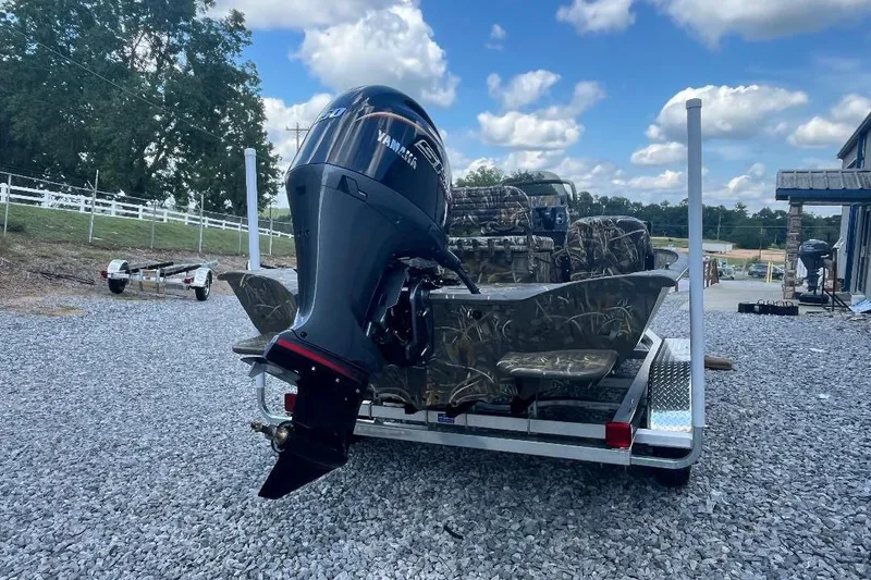 Slide: The Image of 2026 War Eagle 2170 Blackhawk boat with Yamaha outboard motor on a trailer. - 3