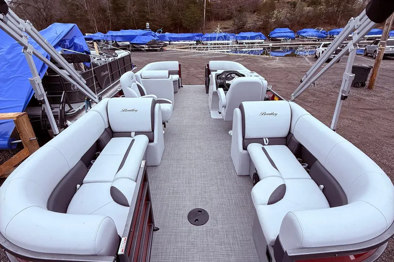Slide: The Image of 2025 Bentley Pontoons Legacy Navigator with luxurious seating and modern design. - 10