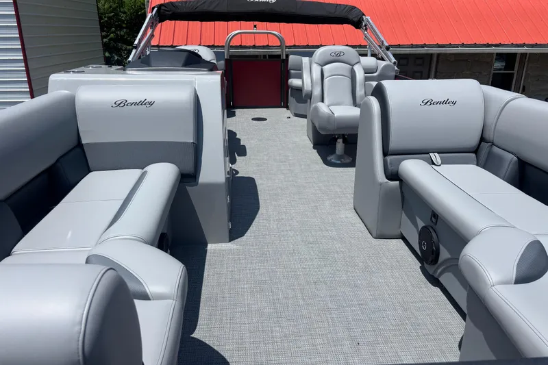 Slide: The Image of 2025 Bentley Pontoons Legacy Navigator with luxurious gray seating and sleek design. - 6