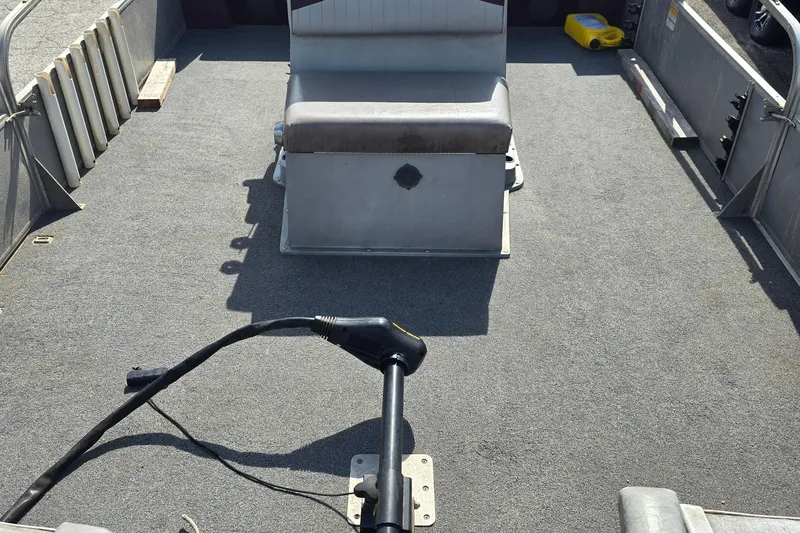 Slide: The Image of Interior of a 1988 Starcraft SD200 boat with seating and equipment. - 2