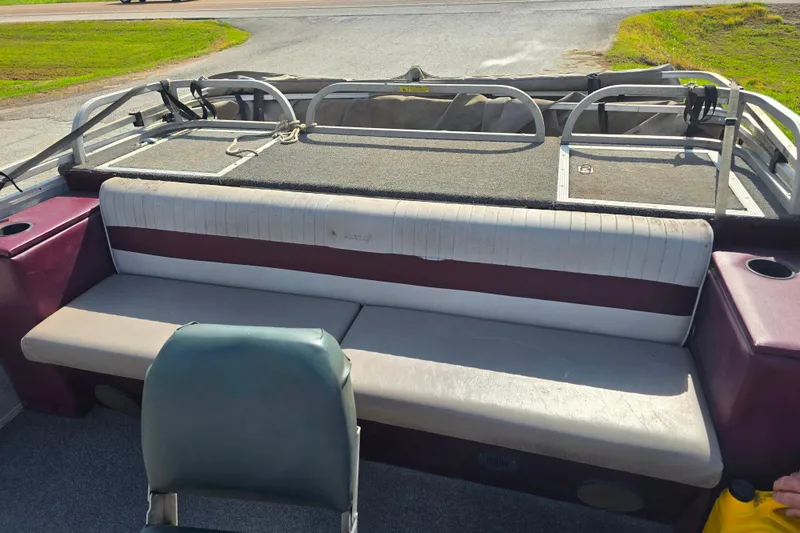 Slide: The Image of 1988 Starcraft SD200 boat interior with seating and storage compartments. - 8