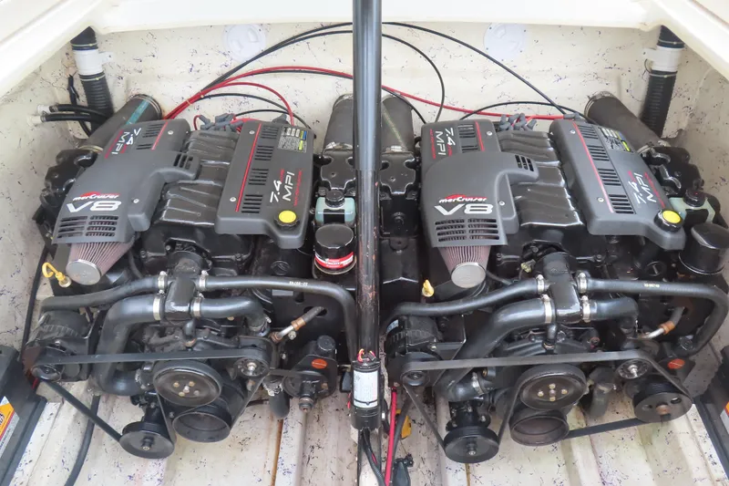 Slide: The Image of Twin MerCruiser V8 engines in a 1998 Magic 34 Sorcerer boat. - 16