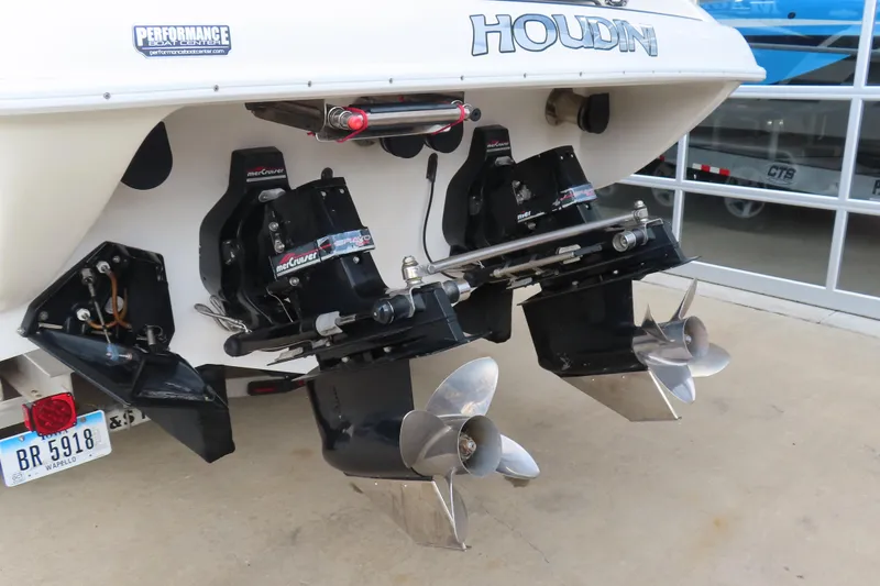 Slide: The Image of 1998 Magic 34 Sorcerer boat with dual MerCruiser outdrives and stainless steel propellers. - 21