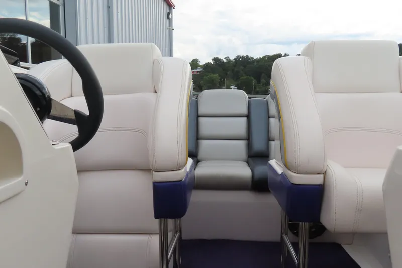 Slide: The Image of Interior of a 1998 Magic 34 Sorcerer boat with white and blue seating. - 6