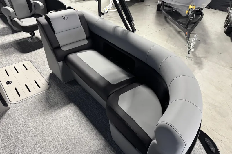 Slide: The Image of Luxurious seating on 2026 Premier 230 SunSation RF pontoon boat, featuring sleek gray upholstery. - 10