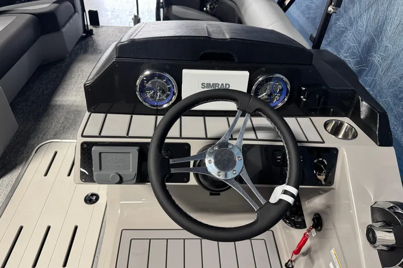 Slide: The Image of Steering console of 2026 Premier 230 SunSation RF boat with modern controls and gauges. - 13