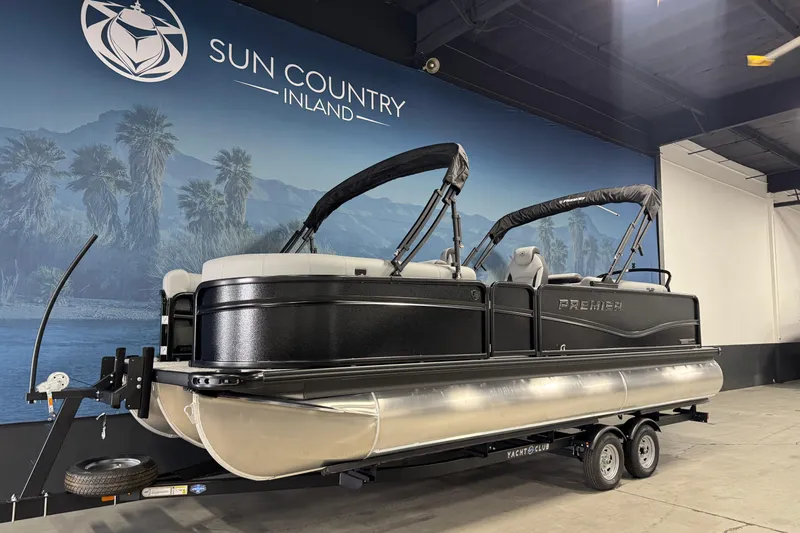 Slide: The Image of 2026 Premier 230 SunSation RF pontoon boat displayed indoors at Sun Country Inland. - 4