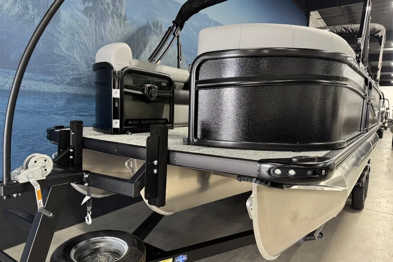Slide: The Image of 2026 Premier 230 SunSation RF pontoon boat on trailer, indoor display. - 7