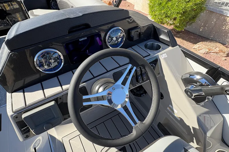 Slide: The Image of Steering console of 2026 Premier 230 Sunsation RL boat with modern controls and dashboard. - 5