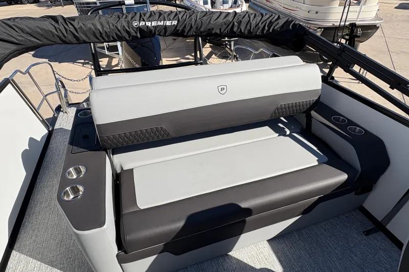 Slide: The Image of 2026 Premier 230 Sunsation RL boat interior with cushioned seating and cup holders. - 6