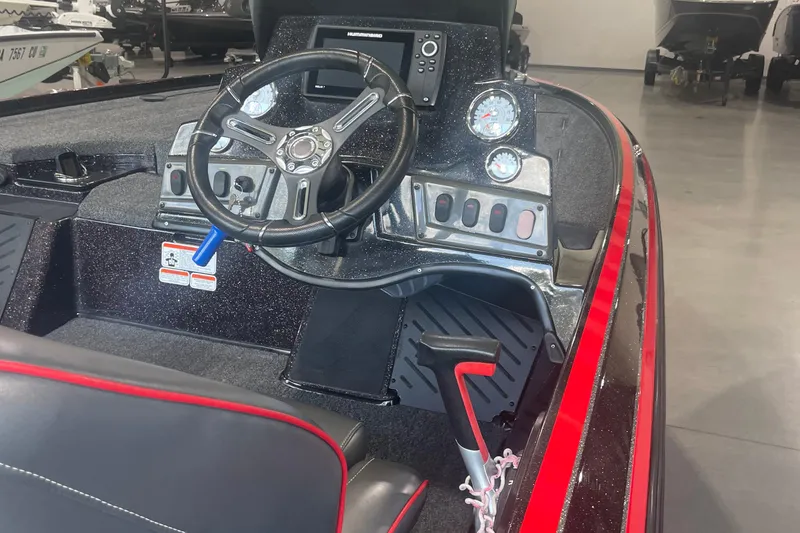 Slide: The Image of 2020 Nitro Z18 boat dashboard with steering wheel and control panel. - 11