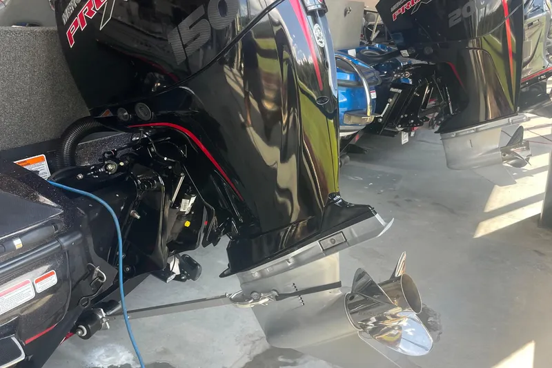 Slide: The Image of 2020 Nitro Z18 boat engines with shiny propellers in a showroom. - 5