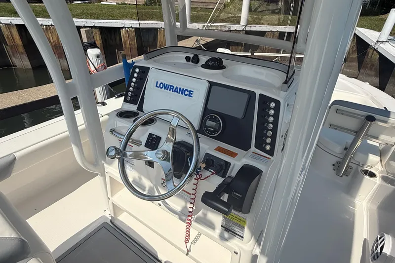 Slide: The Image of 2022 Robalo 226 Cayman boat dashboard with Lowrance navigation system. - 13