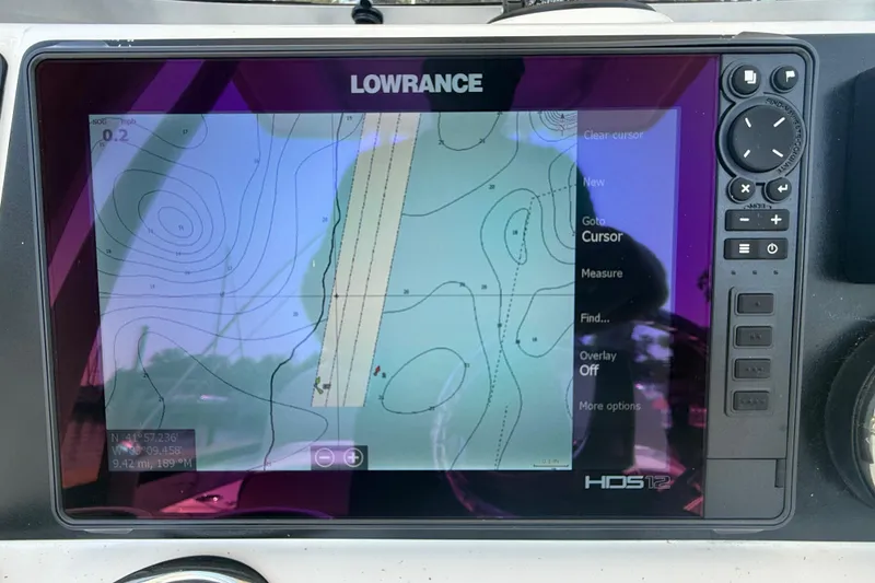 Slide: The Image of Lowrance HDS-12 display on 2022 Robalo 226 Cayman, showing navigational map and controls. - 17