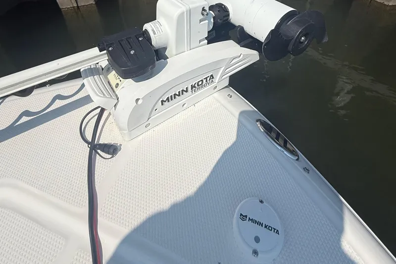 Slide: The Image of 2022 Robalo 226 Cayman boat with Minn Kota Terrova trolling motor on deck. - 22