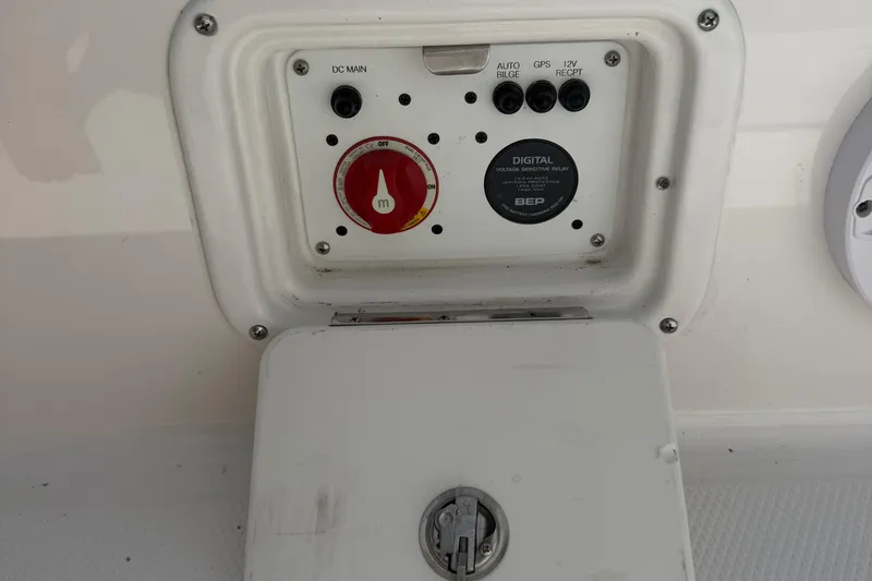 Slide: The Image of Control panel of 2022 Robalo 226 Cayman boat with switches and dials. - 25